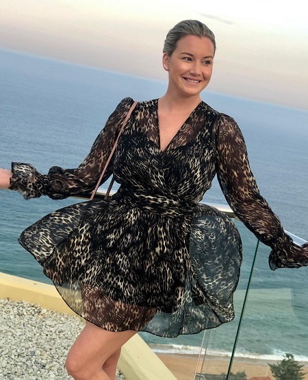 Hannah Ferrier photographed on the top floor a seaside restaurant by her boyfriend not seen there.